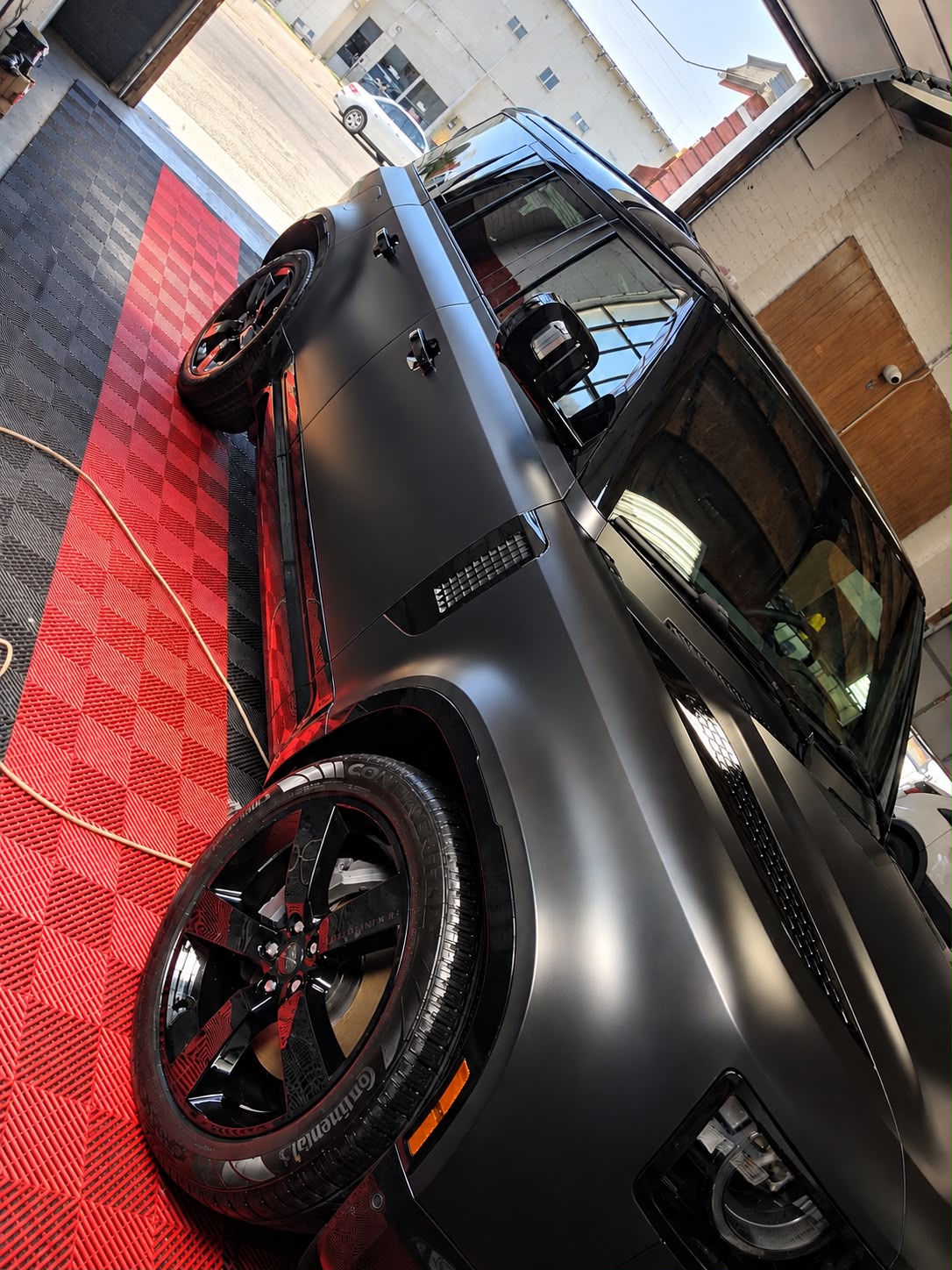 Matte black SUV at the NelMany detailing shop
