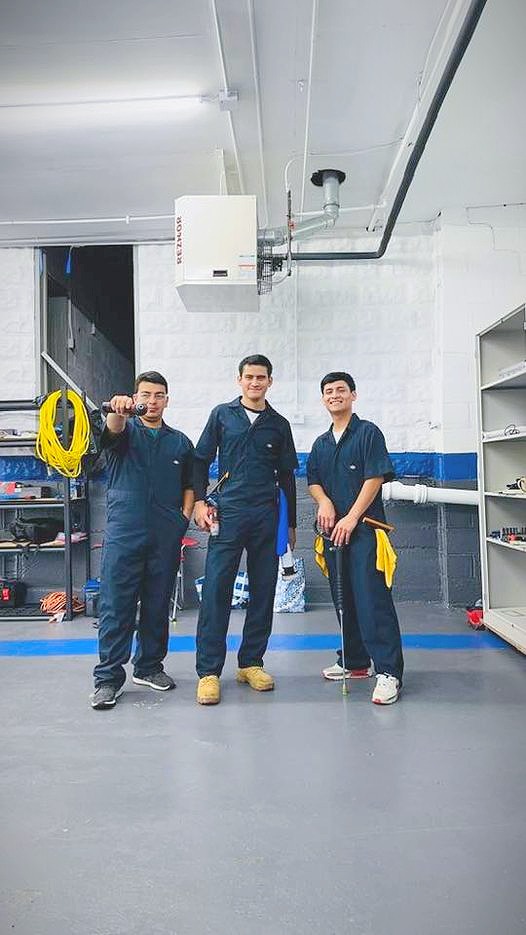 The NelMany team together at the shop